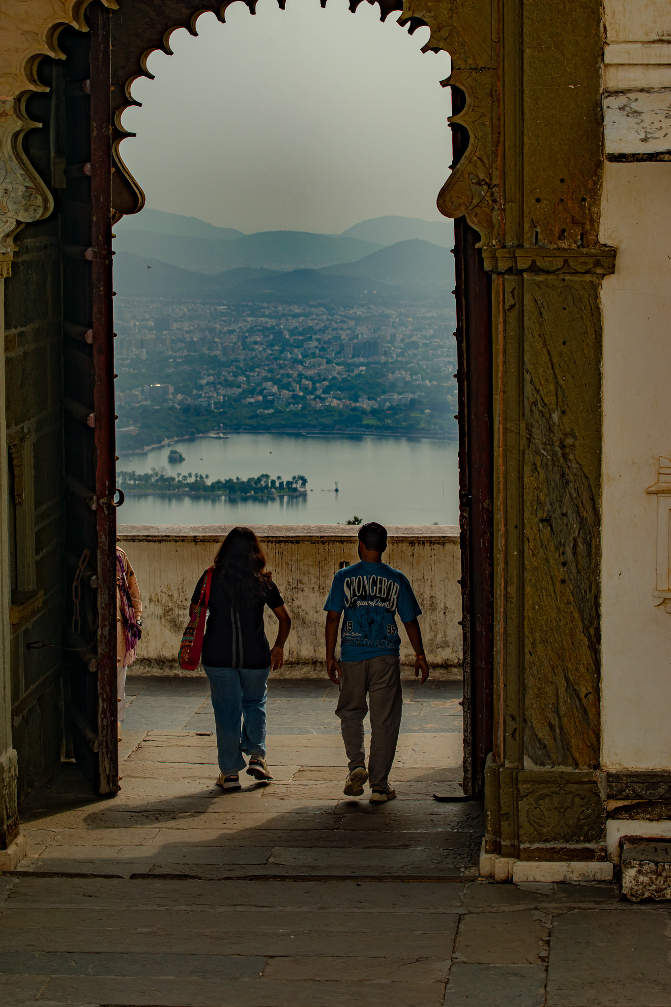 Stone steps in Udaipur framed by architecture and leading lines.